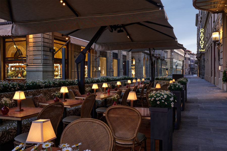 The Hotel Savoy's outdoor veranda with NEOZ's Aged Brass Albert Cordless Table Lamp