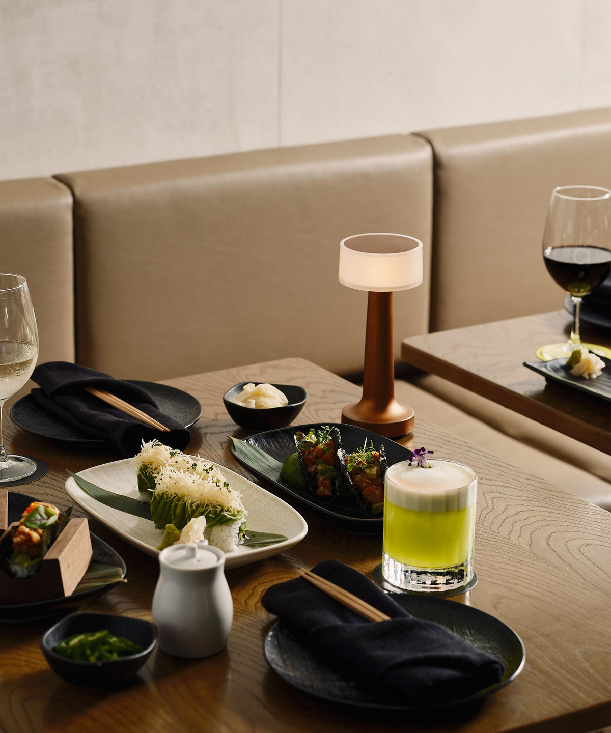 NEOZ Cooee 2C portable table lamps illuminating Japanese cuisine at Terasu Restaurant in Townsville