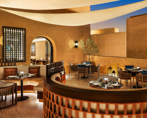 Outdoor dining with NEOZ Piccolo Portable Lamp at Taleed by Michael Mina 